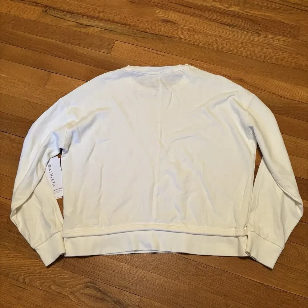 NWT ATHLETA Women’s Sundown Sweatshirt 2.0 White XS Stain New Workout Top